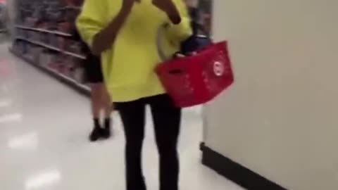 Big Mike AkA "Michelle Obama" goes shopping unnoticed in a St. Louis Target store.