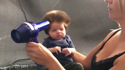 Nine-Week-Old Baby Has A Full Head Of Bouffant Hair