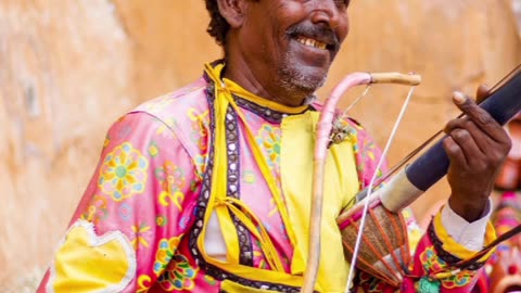 Indian folk musician with folk instruments Ektara