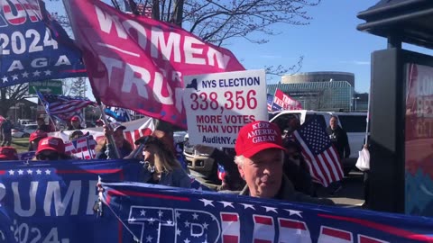 People chant "We love Trump!" outside of a DeSantis event in New York