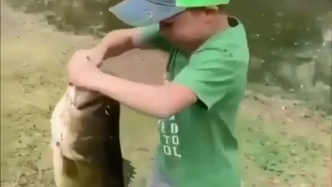 Little Kid Catches A Huge Fish