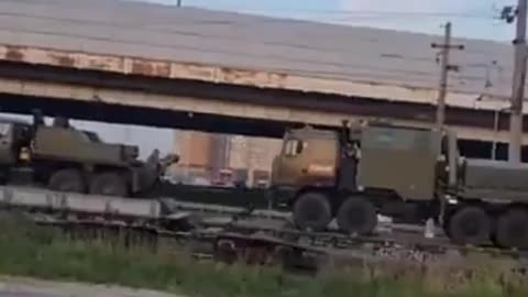 A Russian military train carrying various types of military equipment is en route to the Kursk front