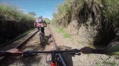 Cyclists Narrowly Avoid Oncoming Train