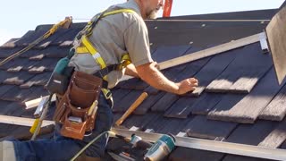 Father with Parkinson's Repairs Roof with Daughter