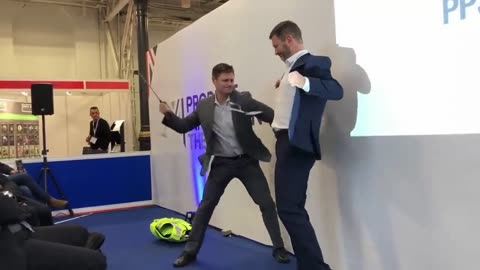 Body armor company demonstrate their “stab protection” vest on their CEO