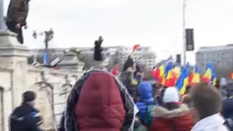 Romanian citizens gather outside Parliament today protesting against health passport in workplaces