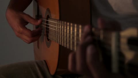 person playing guitar