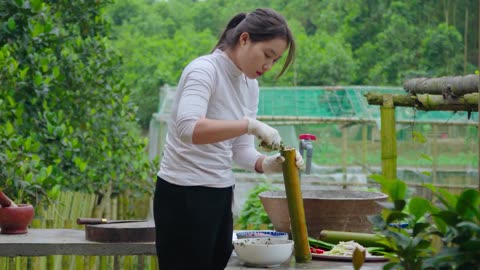 Girls struggled to harvest Eels on the Riverbank - Use PVC pipes to trap eels