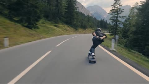 Long board downhill across the Austrian Alps.