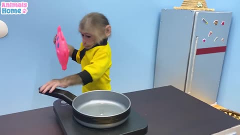 Monkey making dinner for his owner