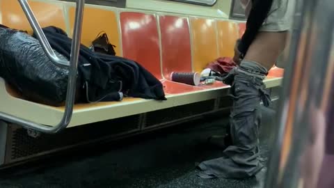 Man in a subway train takes off his pants and underwear