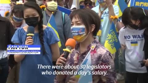 Demonstrators march in Taiwan's capital Taipei to protest against the Russian invasion of Ukraine