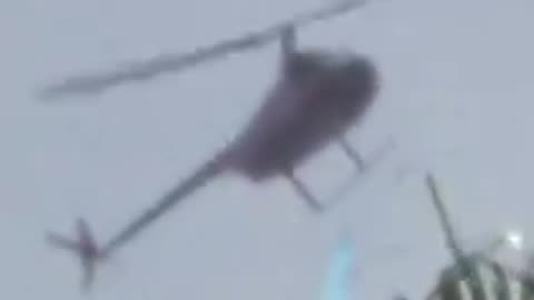 A woman in Florida captured footage of a helicopter spraying a mysterious blue chemical?!?