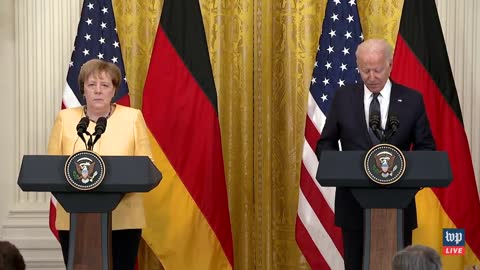 Animated corpse, Joe Biden, slurs words as Merkel pretends not to notice.