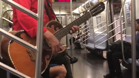 Two man mariachi singing subway cowboy hat