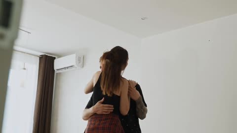 Cute Couple Dancing in the Room