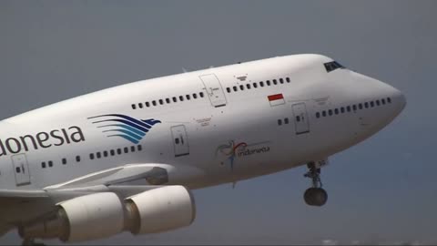 Garuda Indonesia plane takes off flying in the sky