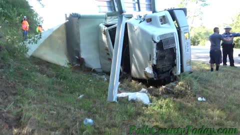 LARGE TRUCK CRASHES THROUGH SIGN, TURNS OVER, LIVINGSTON TEXAS, 10/08/21...