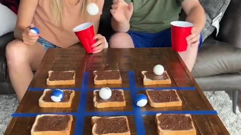 Couple playing tic tac toe