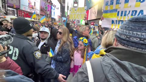 Pro- and anti-NATO demonstrators clash in Times Square.