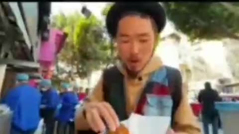 Man making tasty shawarma mix with tomato mint parsley and creamy sauce with fresh mango juice