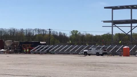 May 1, 2020 - A Train Rolls Past the Little Giants Stadium Construction Site