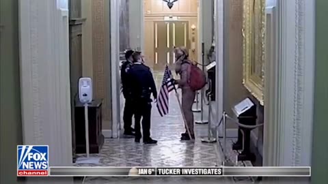 January 6 Video Shows Capitol Police Escorting QAnon Shaman To Senate Floor