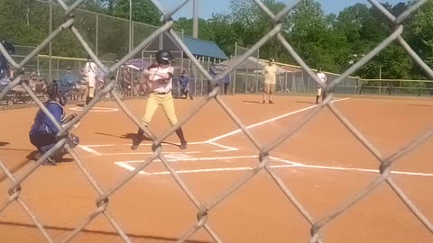 Maddie playing softball