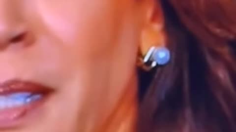 Kamala caught wearing ear piece