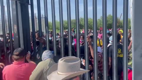 Large Group Of Migrants Arrive At US Border