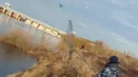 RUSSIAN PLAIN DODGING A FLOCK OF BIRDS, HIT A POWER LINE IN