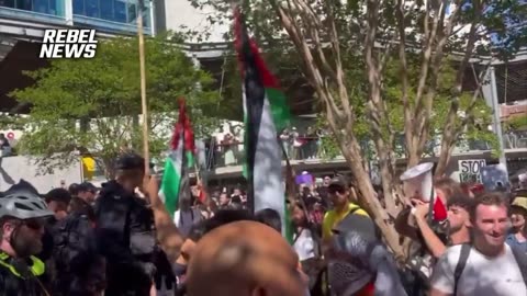 A group of Māoris perform a haka against anti-Israel protesters in Brisbane, Australia.