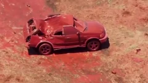 The weight and the power of fire retardant dropped on a vehicle.