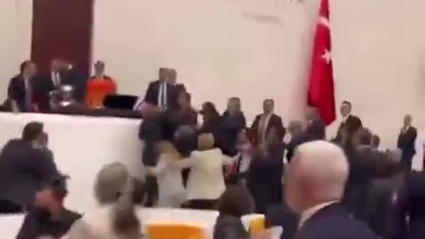 Fist fight in the Turkish Parliament today between MPs of Erdogans party and Kurdish MPs.mp4