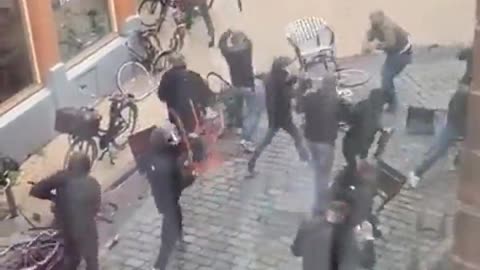 Some Football Hooligans Throw Chairs And Fight In The Street