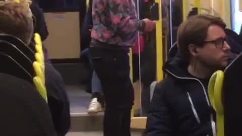 Sunglasses pink sweater man dances on bus in stockholm sweden