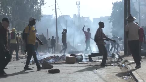 Protesters, police clash after Senegal's election delay