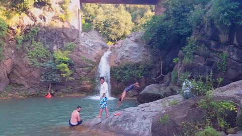 People jumping in deep water from height while risking their lives