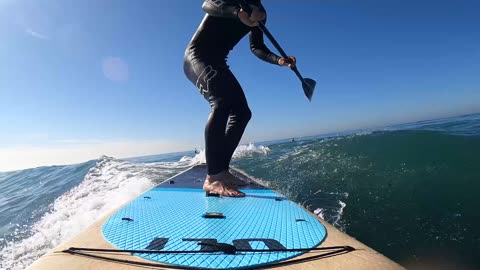 just a couple of kooks surfing a Stand Up Paddle board