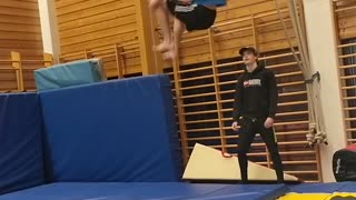 Man blue shirt runs jumps flip fail