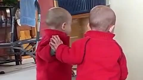 Baby loves his friend of the mirror very funny