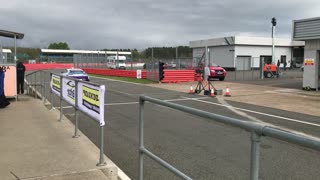 Aston Martin Race Car Going on Track at Silverstone