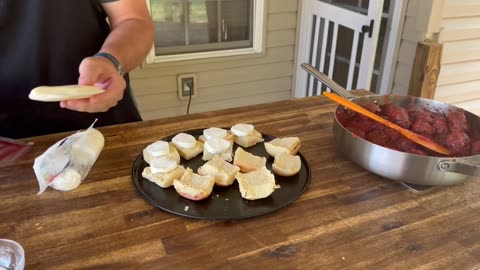 My new favorite party appetizer is smoked meatball sliders, which are made-at-home meatballs smoked.