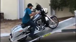 Loading motorcycle into truck