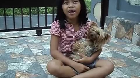 Little Balinese sings the national anthem of Indonesia.