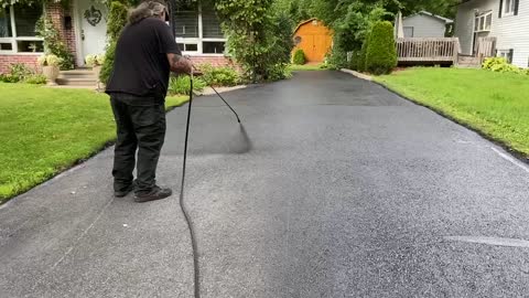 Professional Asphalt Spray Sealing: “The Orange Shed One” Top Coats Pavement Maintenance