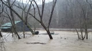 Man Saves Horses from Flooded River