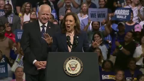 Kamala smiles as the crowd chants "lock him up"