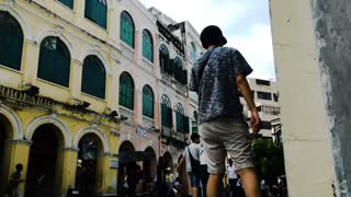 People In The Street Crossing Old Buildings