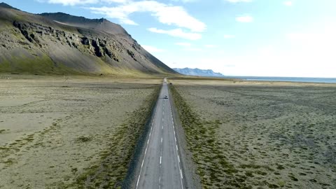 Car driving on an empty road in the countryside